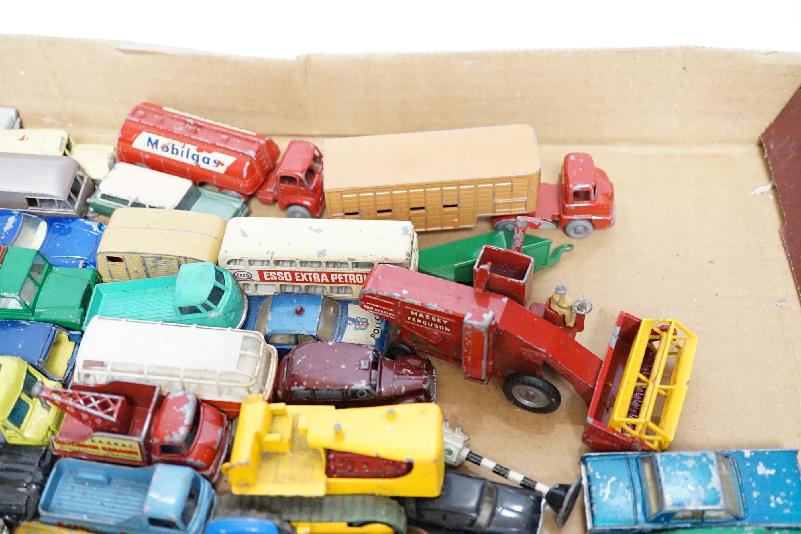 A collection of diecast vehicles by Corgi Toys, Dinky, Spot-On, Matchbox, etc. including 38, corgi toys; a Batmobile, a gold James Bond Aston Martin, a Man From UNCLE Oldsmobile, etc. 18 Husky Toys, ten Dinky Toys, etc.